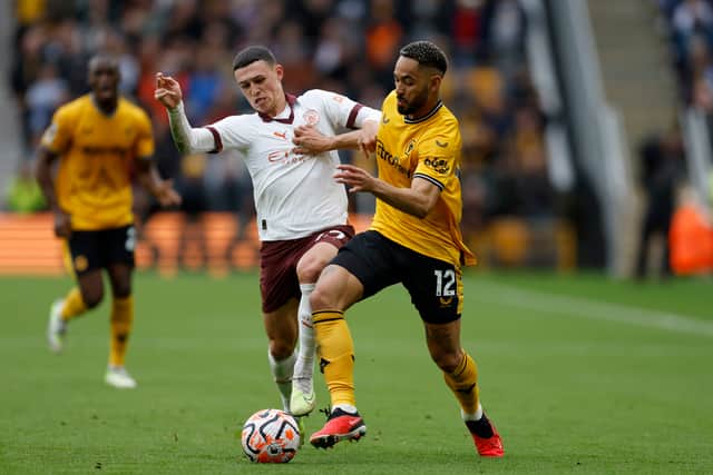 Manchester City's Phil Foden (left) and Wolverhampton Wanderers' Matheus Cunha