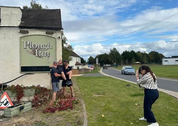 The trio outside the pub