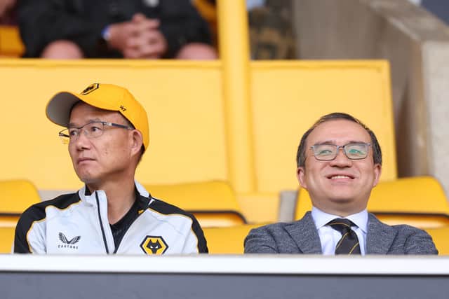 Executive Chairman, Jeff Shi (right) and owner of Wolves Guo Guangchang (Getty)