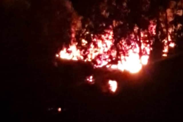 The Crooked House on fire shortly after midnight on Sunday. Photo: Ash Smith