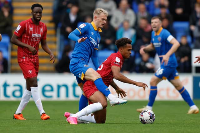 Taylor Perry of Shrewsbury Town and Elliot Bonds of Cheltenham Town (AMA)