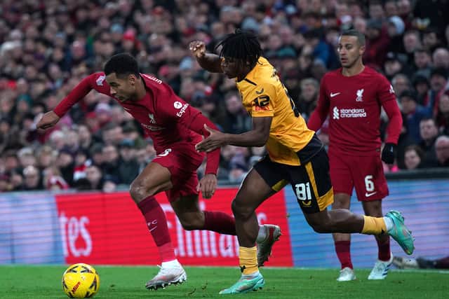Liverpool's Cody Gakpo and Wolverhampton Wanderers' Dexter Lembikisa. Picture: Peter Byrne/PA Wire.