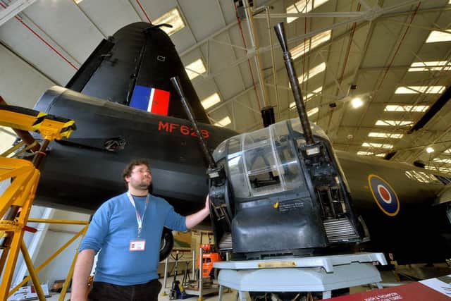 Curator Tom Hopkins and the Wellington bomber