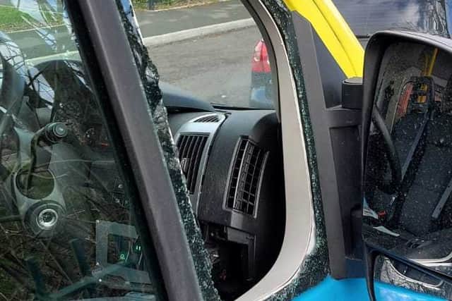 Smashed window on the minibus
