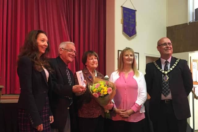 Irene Metcalfe, centre with her award