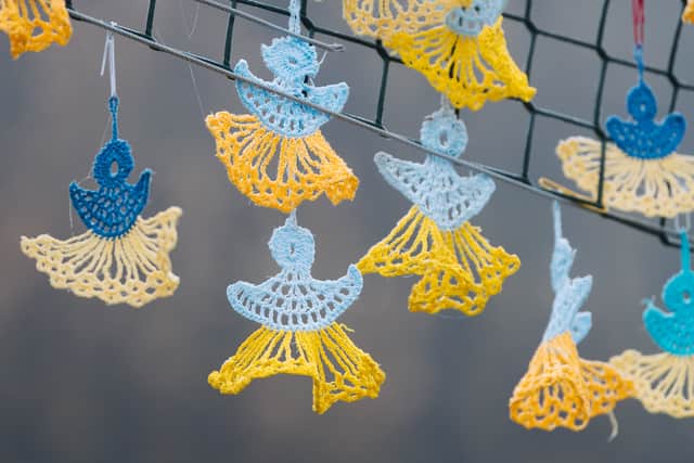 The artwork is made up of 500 hand-made angels, each representing a child killed in the war in Ukraine.