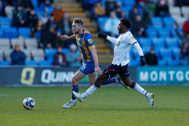Matthew Pennington of Shrewsbury Town and Oladapo Afolayan of Bolton Wanderers (AMA)