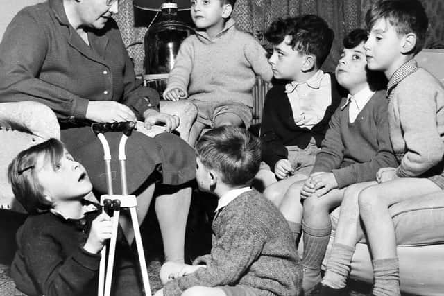 Story time with Miss Lunt at Overley Hall in November 1961.
