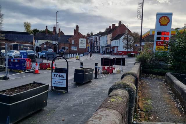Looking down Upper Bar from outside what is now a Greggs. St Nicholas Church is visible further down the street