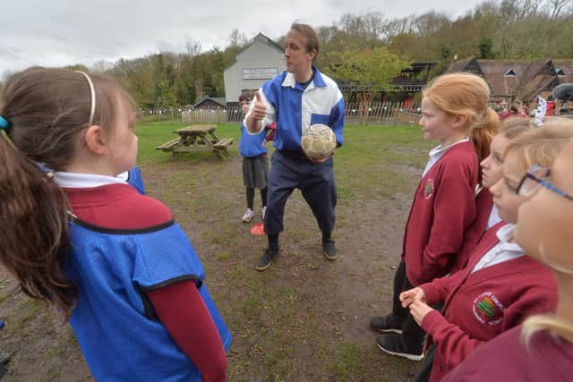 Children from Christ Church CE School in Shrewsbury warm up before a kick-about with with Simon Tisdale from the Shrewsbury FC Foundation