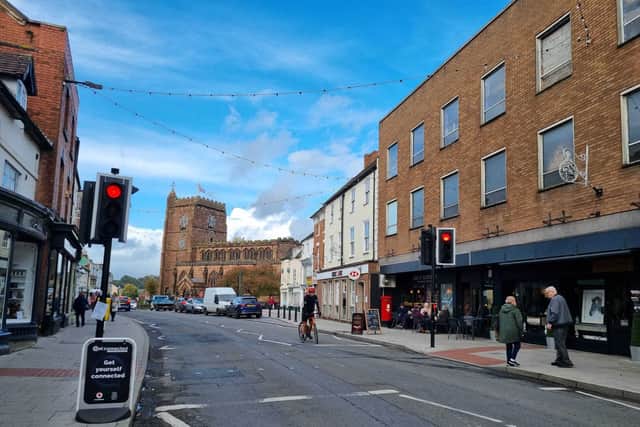 Looking down Upper Bar from outside what is now a Greggs. St Nicholas Church is visible further down the street