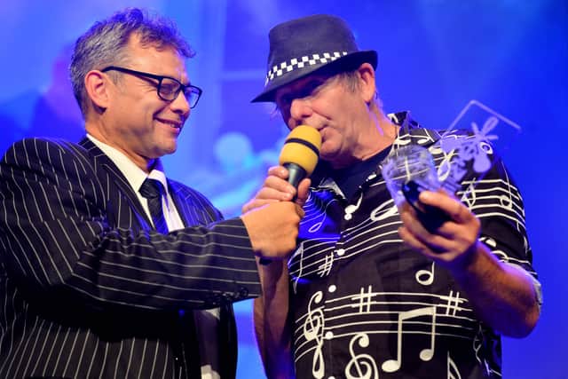 Shropshire Music Awards. BBC's Paul Shuttleworth presents the local Legend award to Mick Keefe..