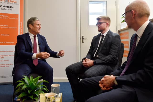 Sir Keir Starmer speaking to Zach Oakley from Acorn to Oaks Financial Services as Pat McFadden MP looks on