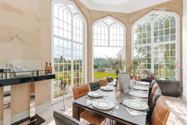 The dining room offers wonderful views of the private garden and countryside beyond. Photo: Savills
