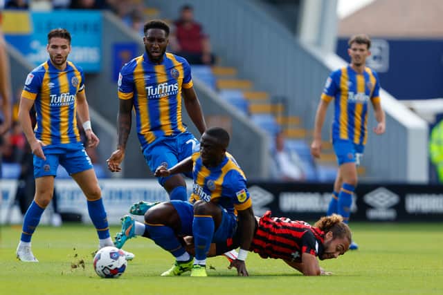 Dan Udoh of Shrewsbury Town and Marcus Harness of Ipswich Town (AMA)