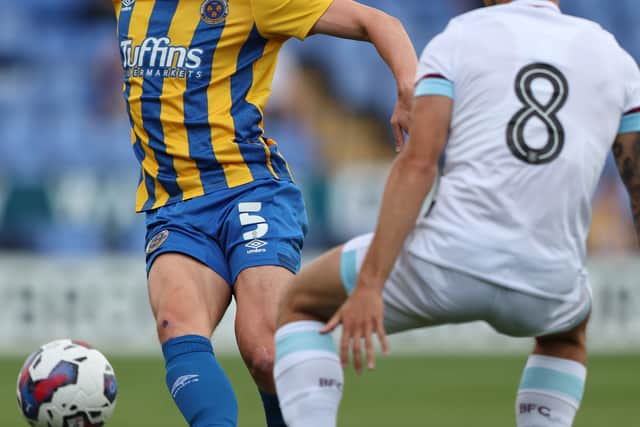 Matthew Pennington of Shrewsbury Town and Josh Brownhill of Burnley (AMA)