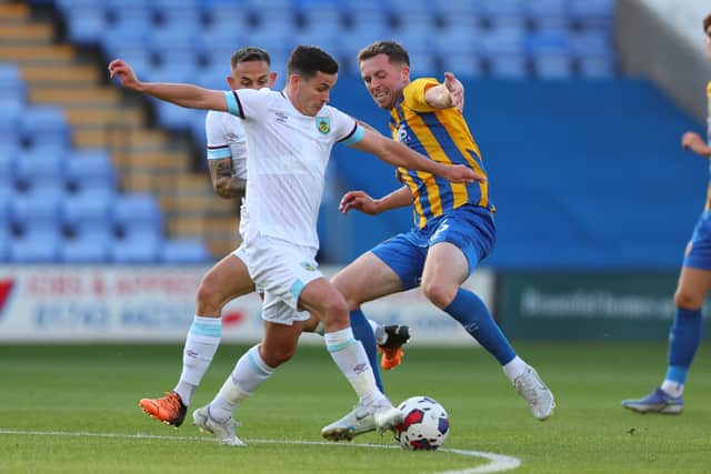 Jordan Shipley of Shrewsbury Town and Josh Cullen of Burnley (AMA)