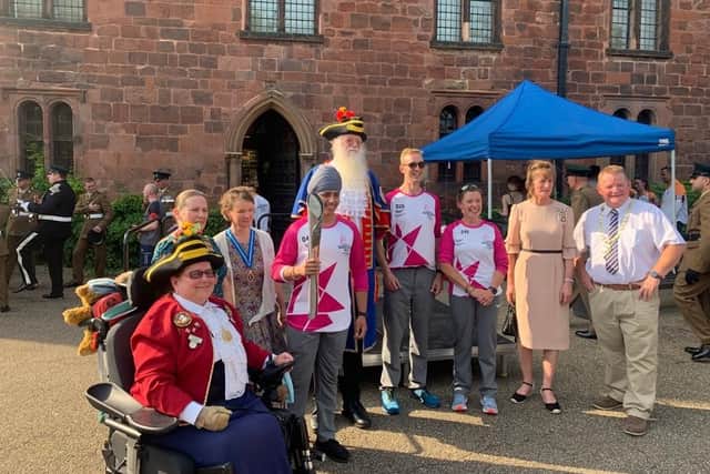 Baton-bearers and dignitaries with the baton at Shrewsbiury Castle with the baton. Photo: Shropshire Council.