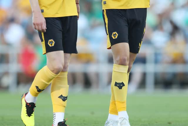 FARO, PORTUGAL - JULY 30: Max Kilman of Wolverhampton Wanderers speaks with Nathan Collins during the pre-season match between Wolverhampton Wanderers and Sporting CP at Estadio Algarve on July 30, 2022 in Faro, Portugal. (Photo by Jack Thomas - WWFC/undefined).