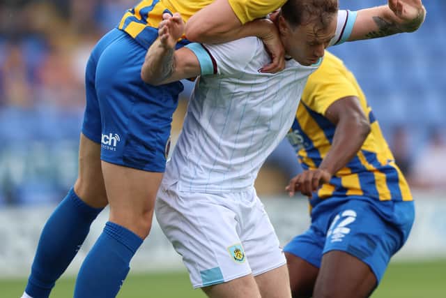 Matthew Pennington of Shrewsbury Town and Ashley Barnes of Burnley (AMA)