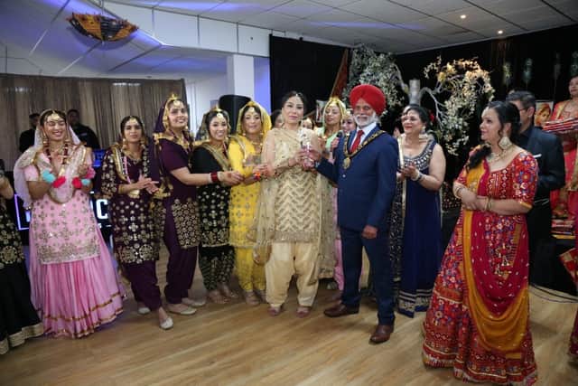 UK's 1st gidha competition winners were Addi Tappa from Derby, with Councillor Amrik Jhowar during the trophy presentation