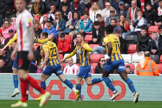 Josh Vela of Shrewsbury Town celebrates after scoring a goal to make it 2-1 (AMA)
