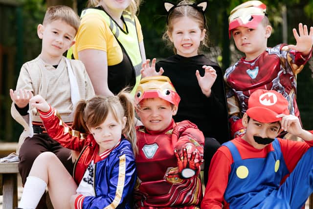  Some of Tommy's Year 1 class, with Tommy in the middle as Iron Man 