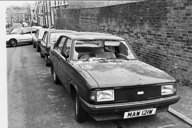 A car in Castlefields, Shrewsbury, damaged by a falling chimney in the 1990 earthquake