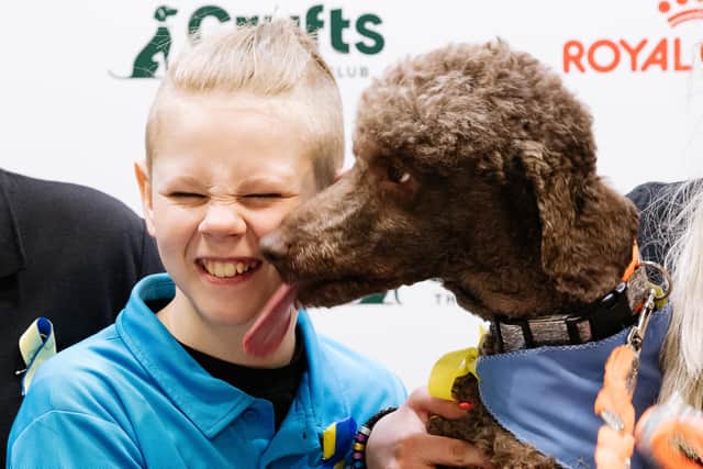 Ewan Looker gets a wet kiss from Rolly