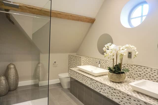 The bathroom features modern fixtures and fittings.