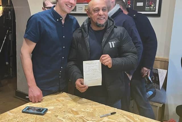 Carlos showing off his Sunday League signing-on form with Matt Brown