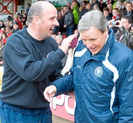 Paul Cook shares a joke with Graham Turner