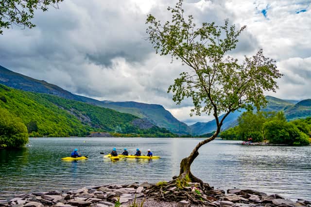 Canoers on Llyn Padarn lake in Snowdonia, Gwynedd. Photo credit: Peter Byrne/PA Wire.