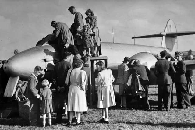 Crowds checking out a Meteor jet fighter