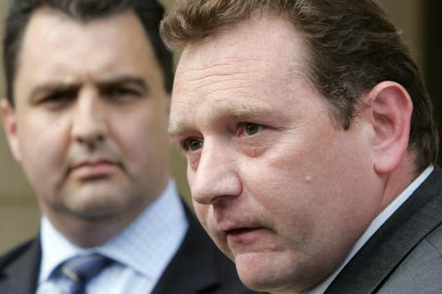 DS Robert Brandon of Scotland Yard's fraud unit, right, and senior Crown Prosecutor Andrew West, speaking to the press about their involvement in the case of conman Robert Hendy-Freegard, outside Blackfriars Crown Court in London, in June, 2005