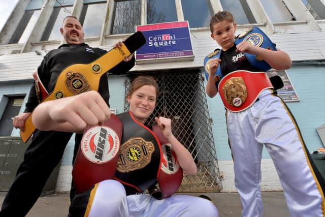 Rising kickboxing stars, Lilimae Marson, 14, and Molli Marson 12, at Central Square Nightclub which is the base for JL Security who have sponsored the girls. Pictured with them is Paul Lucas
