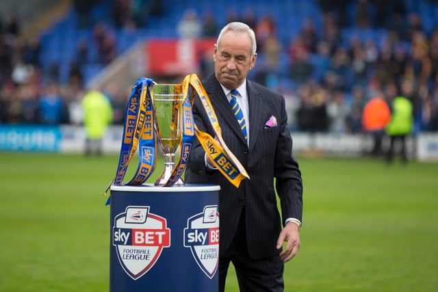 Shrewsbury Town chairman Roland Wycherley and the League Two runners-up trophy (AMA)