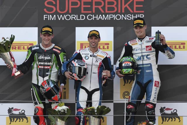 Davies, far right, on the podium with Tom Sykes and Marco Melandri during his debut WorldSBK season