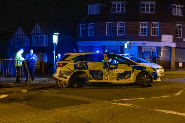 A police car sustained damage in the collision. Picture: Bob Griffiths