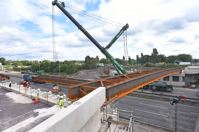 The first beam in position over the M6