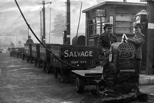 ATS girl Mary Collins (later Mrs Mary Brown) is on a Lister truck being filled with petrol at COD Donnington in 1942 or 1943.
