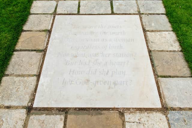 A paving stone engraved with an extract inspired by The Measure of A Man poem