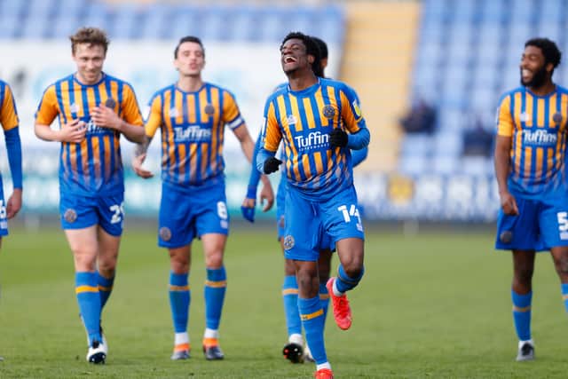 Nathanael Ogbeta of Shrewsbury Town celebrates after scoring a goal to make it 3-0.