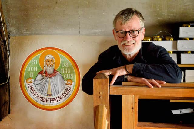 Aidan Hart with one of the roundels he painted