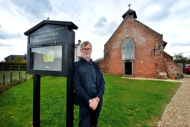 Aidan Hart outside the church