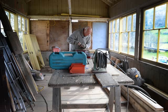 Volunteer Pete Robson at work in the signal box at Corwen station.
