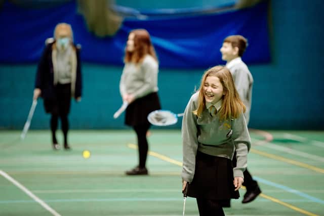 Year 7 pupils enjoy playing badminton in a PE lesson at Sir John Talbot’s School