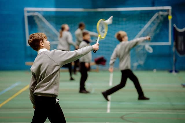 Year 7 pupils enjoy playing badminton in a PE lesson at Sir John Talbot’s School
