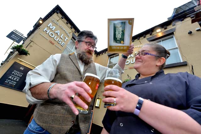 BORDER COPYRIGHT SHROPSHIRE STAR STEVE LEATH 29/10/2020..Pics in Church Stretton at pub: Old Coppers Malt House, celebrating after getting into the Good Beer Guide. Landlords: Heather Wheway and Philip Cole are pictured..