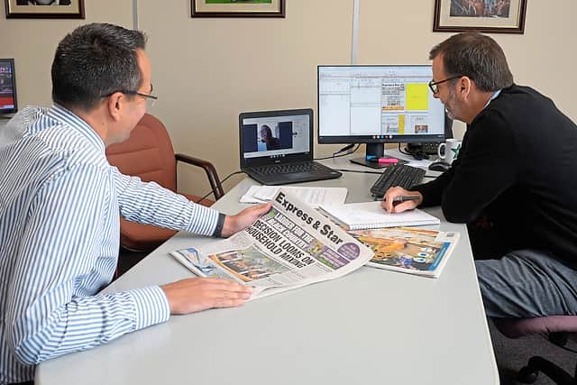 Editor Martin Wright, left, leads an editorial conference with others joining online